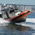 US Coast Guard shoots out migrant boat engine in high speed chase