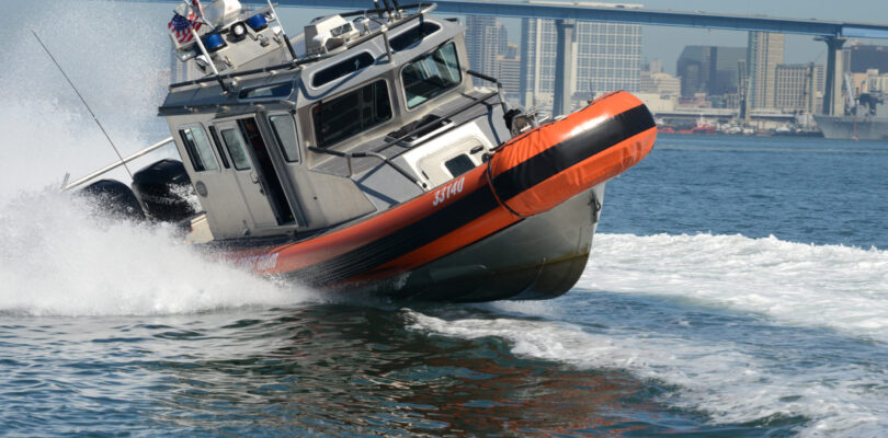 US Coast Guard shoots out migrant boat engine in high speed chase