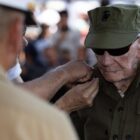 He was bayoneted in Guam. Shot on Iwo. Now, at 100, he is a sergeant.