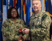 RADM Waters gives Bravo Zulu belt buckles to Chaplains [Image 7 of 8]