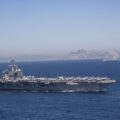 Iran puts ‘fingers on trigger’ as US armada arrives in Middle East