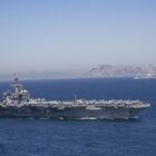Iran puts ‘fingers on trigger’ as US armada arrives in Middle East