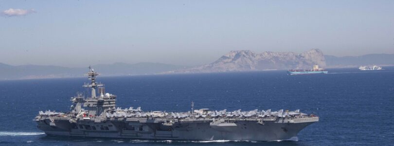 Iran puts ‘fingers on trigger’ as US armada arrives in Middle East