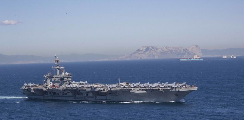 Iran puts ‘fingers on trigger’ as US armada arrives in Middle East