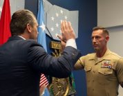 Veteran who lost both of his legs in combat reenlists in the Marine Corps