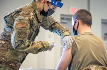 Trump promised redemption for troops who refused COVID shots. A year later, many are still waiting.