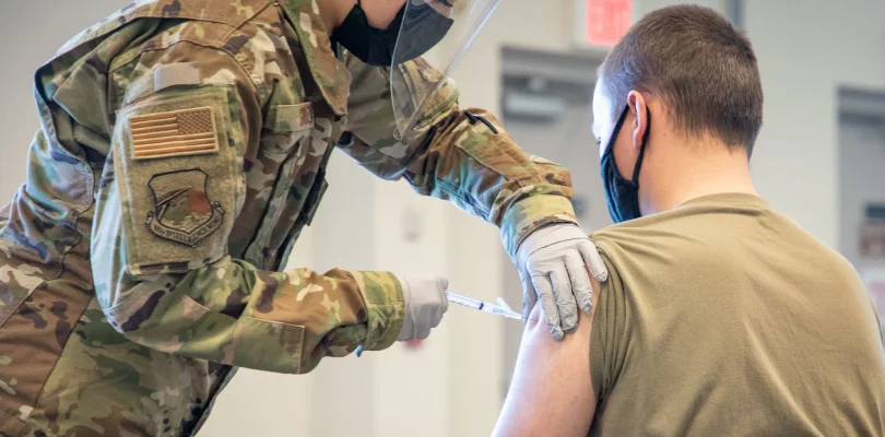 Trump promised redemption for troops who refused COVID shots. A year later, many are still waiting.