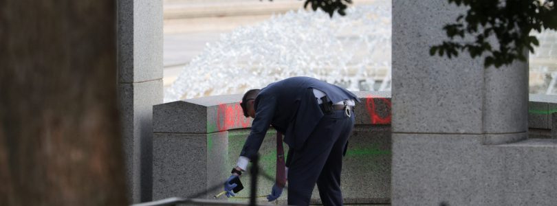 Woman charged over vandalism of World War II Memorial
