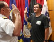Navy captain gives oath of enlistment to son on last day of service